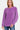 Model wearing a violet waffle knit chenille sweater, front view with round neck.