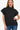 Woman wearing Chic Mock Neck Short Sleeve Sweater, showcasing the slim fit and mock neck design.