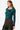 Side view of teal floral knit top with long sleeves on model.