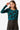 Model wearing a teal knit top with bold black floral print, front view.