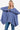 Front view of the Women's Dusty Blue Asymmetrical Knit Top with high-low hem.