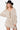 Women's ivory mixed-stitch front tie sweater dress with long sleeves, front view.